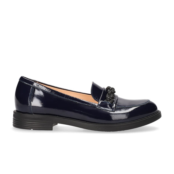 navy  patent leather loafer on a white background