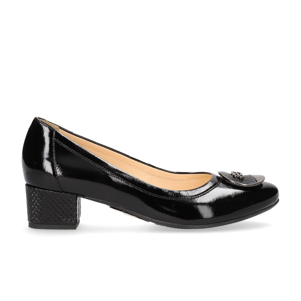 Black patent leather shoe on a white background